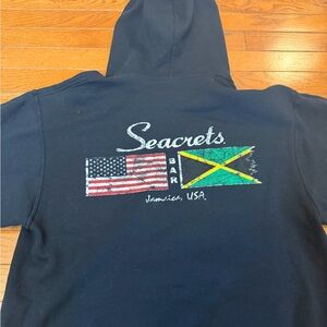 Seacrets of Ocean City Black Hoodie with Flag Graphic